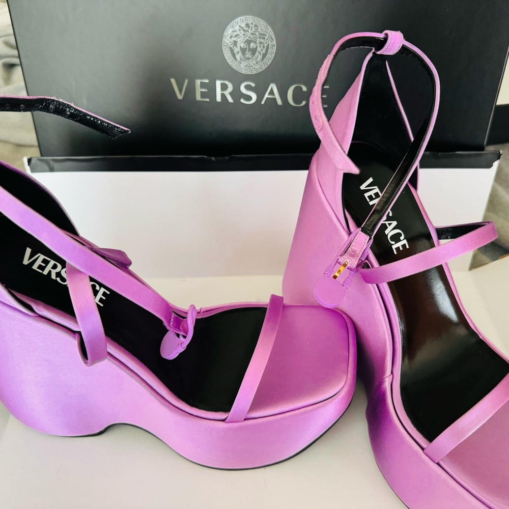 Versace Satin Wedges
Purple
Wrap-Around Straps & Buckle Closure at Ankles
